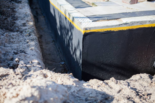 Professional Basement Waterproofing technician working in Lincoln Park, NY